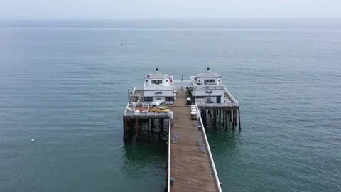Orbiting 4K drone shot of Malibu pier in California Stock Footage 134504873