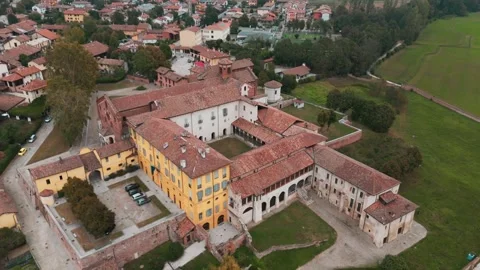 Orbiting Abbazia Morimondo top shot in the countryside of Lombardia close Stock Footage 253770681