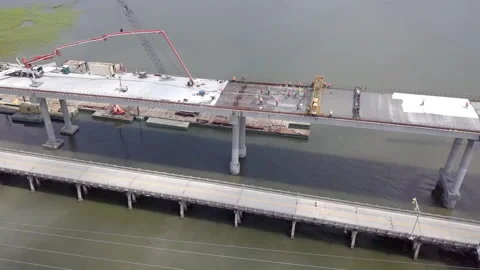 Orbiting aerial shot of bridge construction Stock Footage 137262444