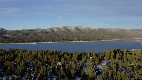 Orbiting Aerial view of Big Bear Lake, CA during a winter morning 4k Drone Stock Footage 316179233