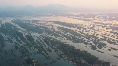 Orbiting aerial view of islets in Don Det, Laos. Cinematic drone shot at sunset Stock Footage 248214471