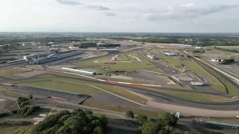 Orbiting aerial view over British Silverstone motorsport race track Vídeos de archivo 236686422