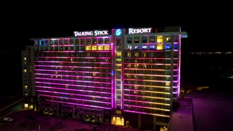 Orbiting aerial view of the Talking Stick Resort at night with its LED Stock Footage 233672312