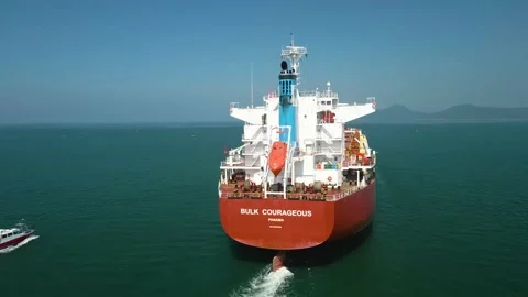 Orbiting and side view of a huge bulk carrier ship aerial footage Stock Footage 225868830