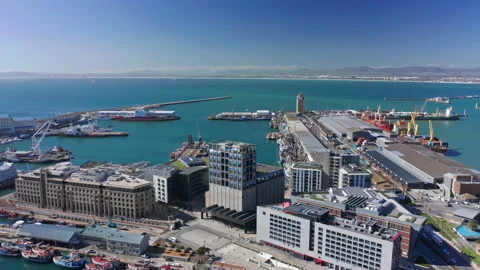 Orbiting around the harbor district at noon, boats and ocean in background. Stock Footage 169864402
