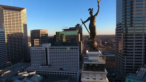 Orbiting Beautiful Statue Of Indianapolis Monument at Sunrise Stock Footage 77708596