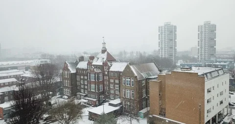 Orbiting drone footage of a snowy victorian manor house in London, England. Stock Footage 87168580