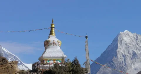 Orbiting Drone Reveal of Chorten Memorial from Ama Dablam to Everest, Nepal Stock Footage 324685933