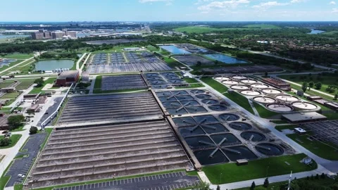 Orbiting drone shot above a large water reclamation facility revealing aeration Stock Footage 339039553