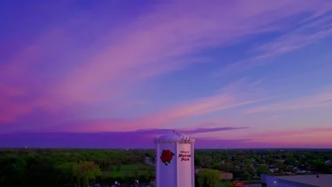Orbiting Drone Shot of Melrose Park Water Tower at Vibrant Sunset Stock Footage 309201914