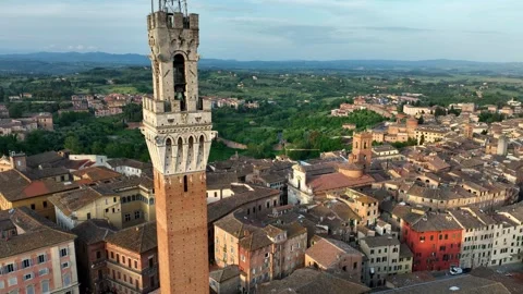 Orbiting drone shot of Siena town in Tuscany, Italy, aerial view of Torre del Video stock 310905585