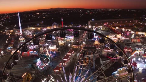 Orbiting Ferris Wheel at Sunset during state fair - shot in 6K by drone Stock-Footage 197526843