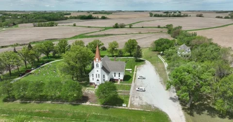 Orbiting flight viewing the rural church and surrounding farm fields Stock-Footage 335670068