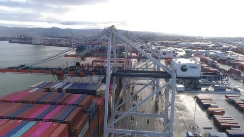 Orbiting Gantry Cranes Loading Giant Container Ship At Oakland Shipyard 動画素材 121387206