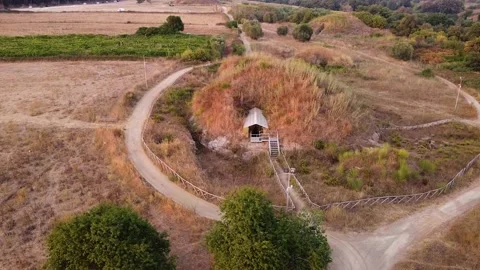 Orbiting a huge ancient tomb, tumulus Stock Footage 137694811