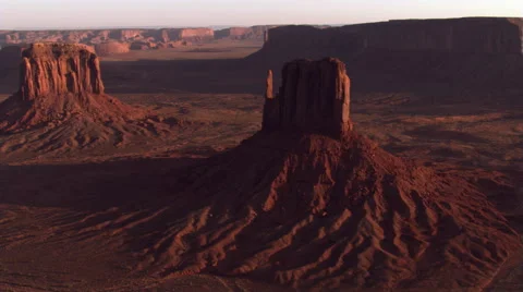 Orbiting Monument Valley's West Mitten Butte at sundown Stock Footage 59526030