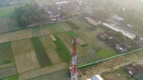 Orbiting Red Internet Provider Tower Above Traditional Market Stock Footage 246793789