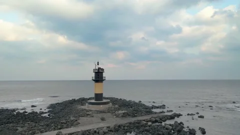 Orbiting Seashore View of Udo-biyangdo from a Lighthouse, Udo, Jeju. Udo is the  Stock Footage 146067163