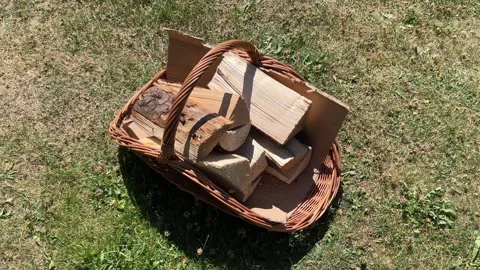 Orbiting shot around basket with chopped firewood, 4k slow motion Video stock 312524286