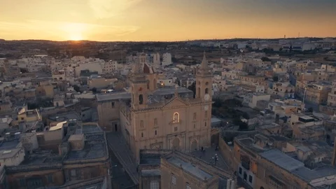 Orbiting shot around St George's Parish Church in Qormi while sunsets Stock Footage 91995850