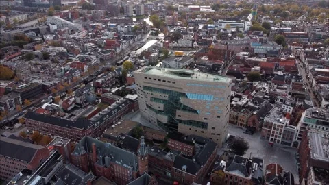 Orbiting shot of the Forum, a modern architectural building in Groningen Video stock 163616936
