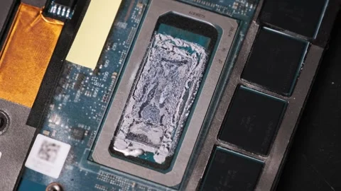 Orbiting Shot of a Processor with Worn Thermal Interface Material Stock Footage 314013476