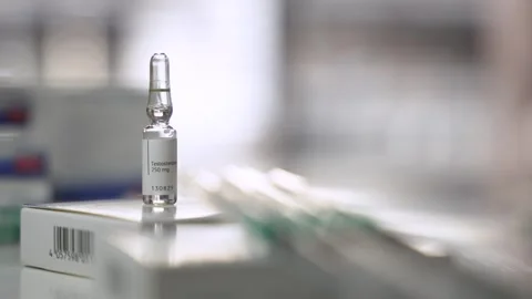Orbiting Shot of Testosterone Ampoule with Syringes Stock Footage 327477397
