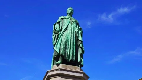 Orbiting a Statue or Archduke Joseph in Downtown Budapest from a Low Angle Stock Footage