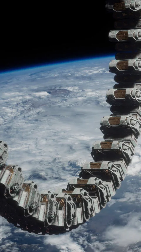 Orbiting structure in space with Earth visible in background Stock Footage 344962688
