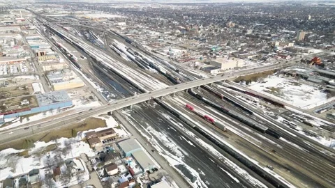 Orbiting timelapse of bridge over industrial train yard Stock Footage 333580301