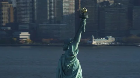 Orbiting the upper portion of the Statue of Liberty, revealing Ellis Island with Stock Footage 59172749