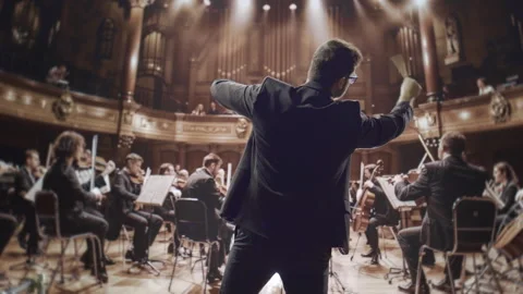 Orchestra Conductor Leading Symphony Performance In Grand Concert Hall Classical Stock Footage 291887849