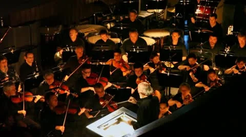 Orchestra in pew plays under direction of Evgenie Samoilov at New Opera Theatre Stock-Footage 9600213
