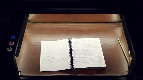 Orchestra pit with instruments and notes, a place for a conductor. slow motion Stock Footage 97505304