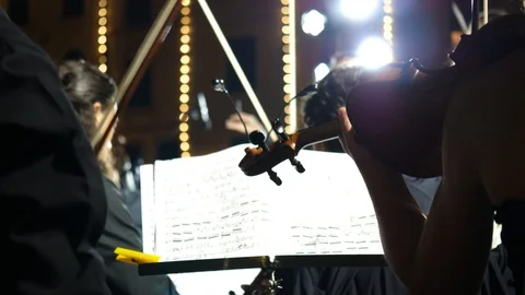 Orchestra playing outside  Stock Footage 95779714