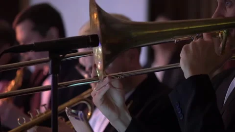 Orchestra with wind instruments at stage. Band playing music at concert. Stock-Footage 170333354