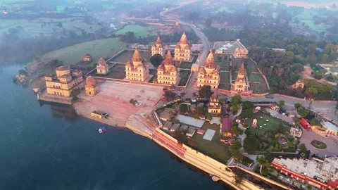 Orchha-royal-cenotaphs-diagonal-pull-back-drone-betwa-river-madhya-pradesh-2 Stock Footage 345201169