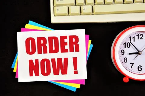 Order now. Text label in notepad. Stock Photos