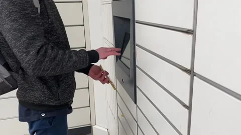 Order online with Alegro. Guy picks up an order from a parcel machine. Stock Footage 237919187