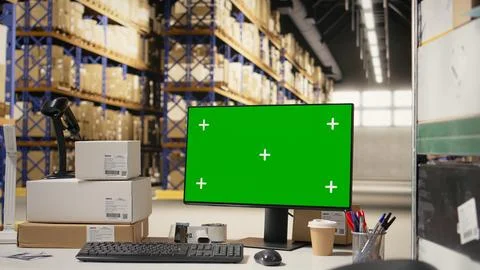 Order processing station desk with copy space on monitor in fulfillment center Stockfoto's
