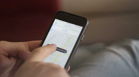 Order taxi via uber app on mobile phone Stock Footage