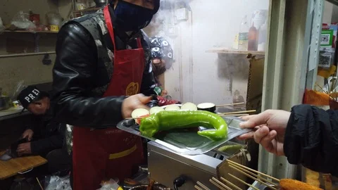 Ordering delicious deep fried stick Chinese street food to chef Video stock 123096738