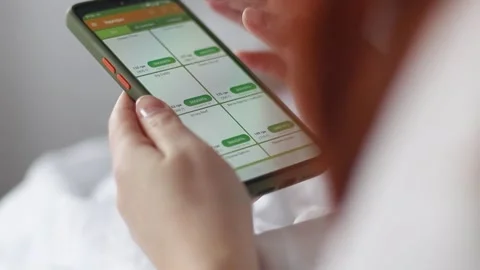 Ordering food online using smartphone app. Orders burger using online delivery Stock Footage 151111712