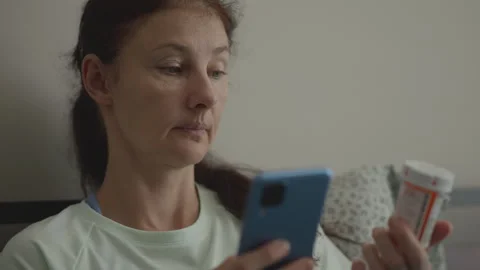 Ordering Medication Online From an Online Pharmacy. Woman Checking Informat.. Stock Footage 319655228