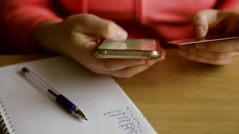 Ordering using food delivery app. E-banking app service Stock Footage 224850564