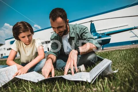 Orderly boy and smiling dad during relax Stock Photos
