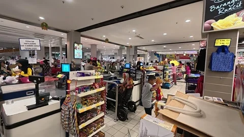 Orderly Queue at Hypermarket Payment Counter with Full Carts Stock Footage 321437422