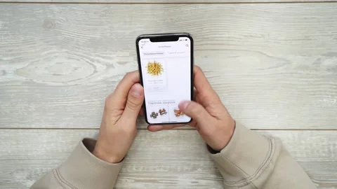 Orders Food Using Online Delivery. Man Orders Food Home In Online Store Using a Stock Footage 143733341