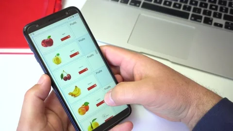 Orders Fruit Using Online Delivery. A man Orders Food Office In An Online 스톡 동영상 145669328