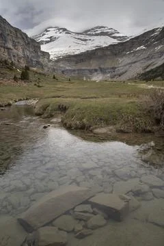 Ordesa valley river flowing through pyrenees mountains Stock Photos